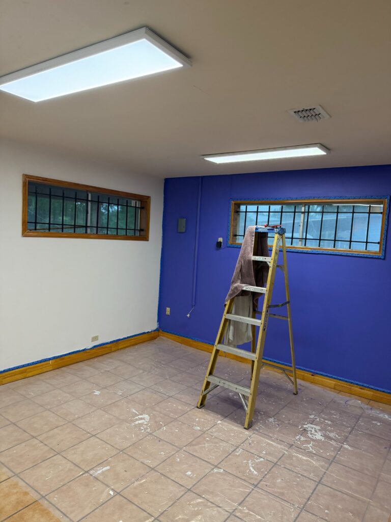 The purple room finished, a ladder still in the corner